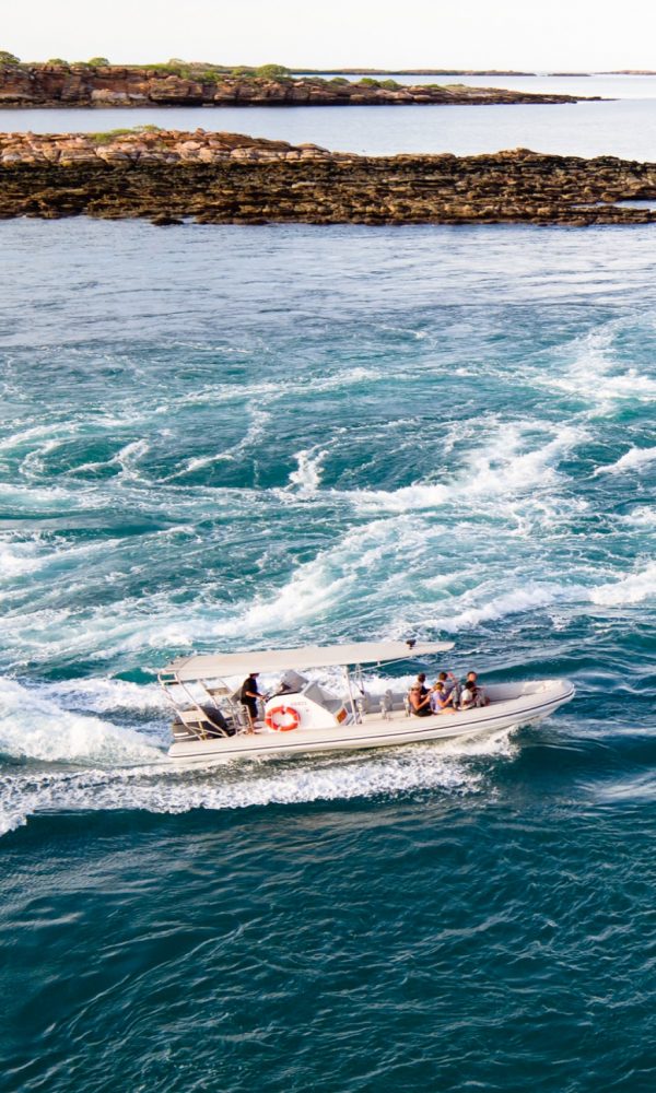 A boat drives through the whirlpools of Cygnet Bay as guests enjoy their Sea Safari, a marine tour quintessential to Cygnet Bay Pearl Farm.