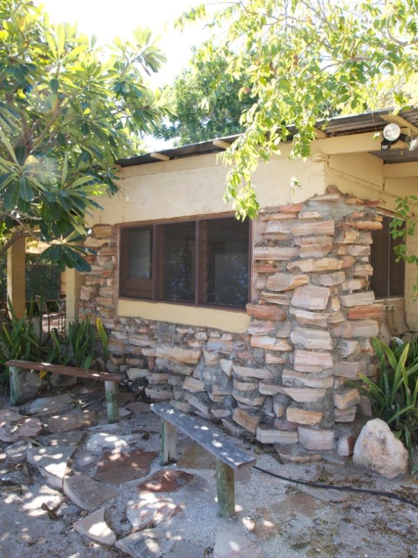 Stone House A Stone House External photo showing the unique design of the accommodation, as well as the native tropical plants and trees surrounding the house.