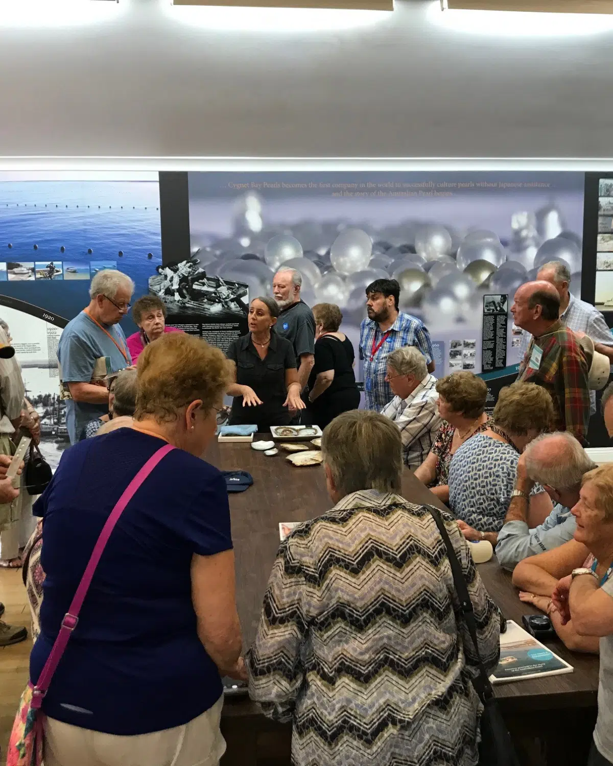 A group of individuals gather around a grading table to bare witness to a live pearl harvest at our Broome Showroom, in the heart of China Town. An incredibly unique and fascinating tour, our Live Pearl Harvests are a must-see tour.