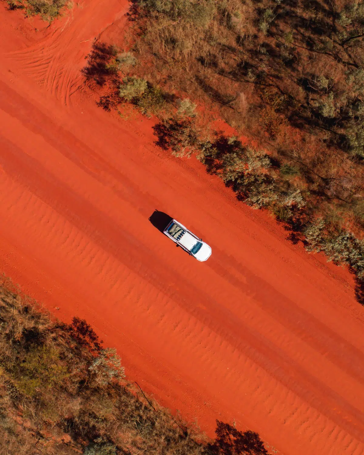 A hired car from BroomeBroome Car Rentals drives to Cygnet Bay Pearl Farm on the red pindan dirt road. Drive, Stay & Discover Offers.