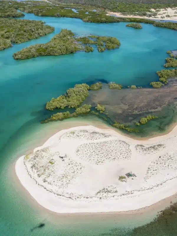 On a helicopter, the passenger enjoys the beautiful views of the Kimberley - the white sandy beaches, lush green foliage and turquoise waters.