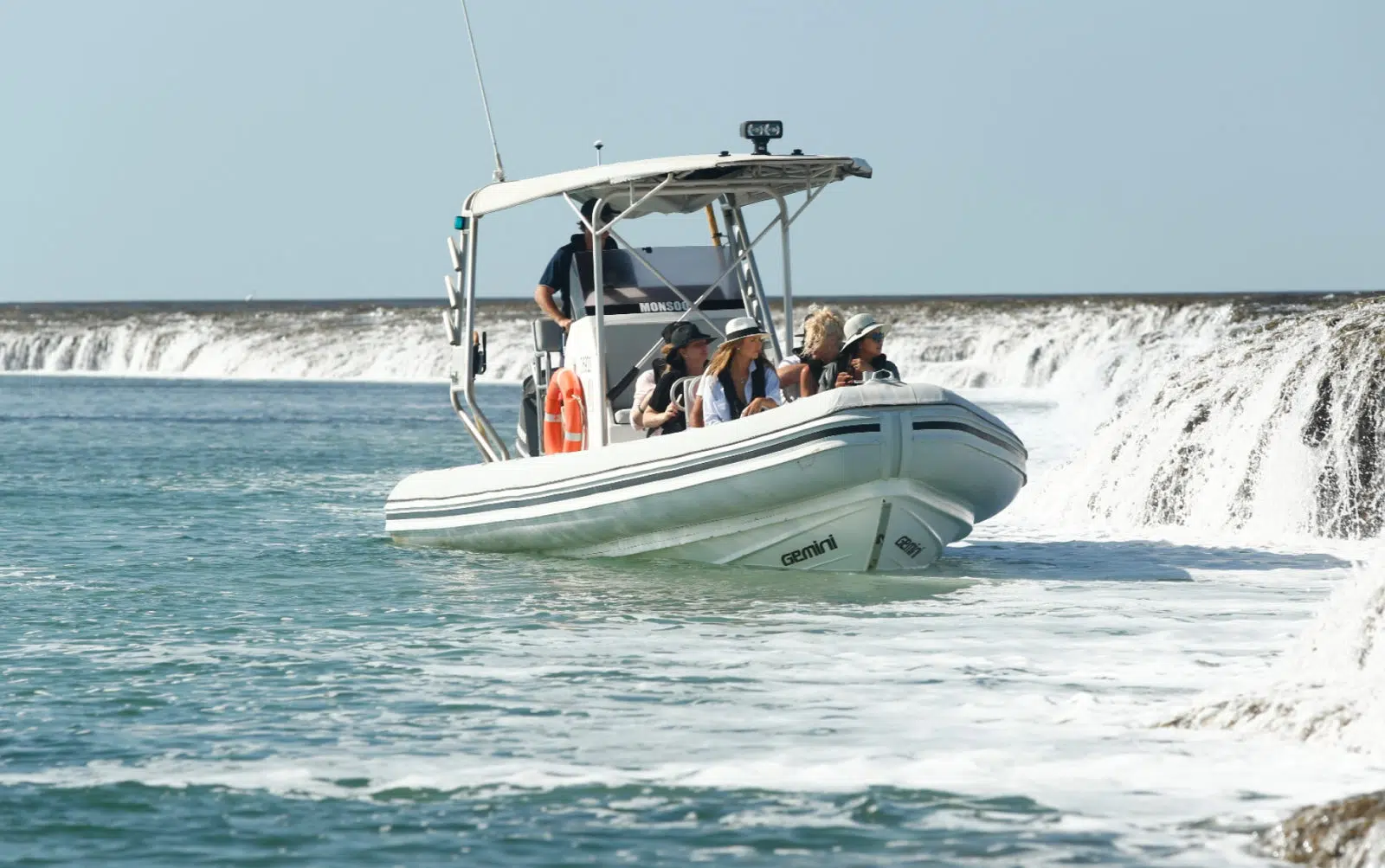 A group of guests on a Waterfall Reef Sea Safari tour available at our Cygnet Bay Pearl Farm enjoy the natural phenomenon that is Waterfall Reef. This phenomenon only occurs during drastic tidal changes, and is a sight not to be missed.