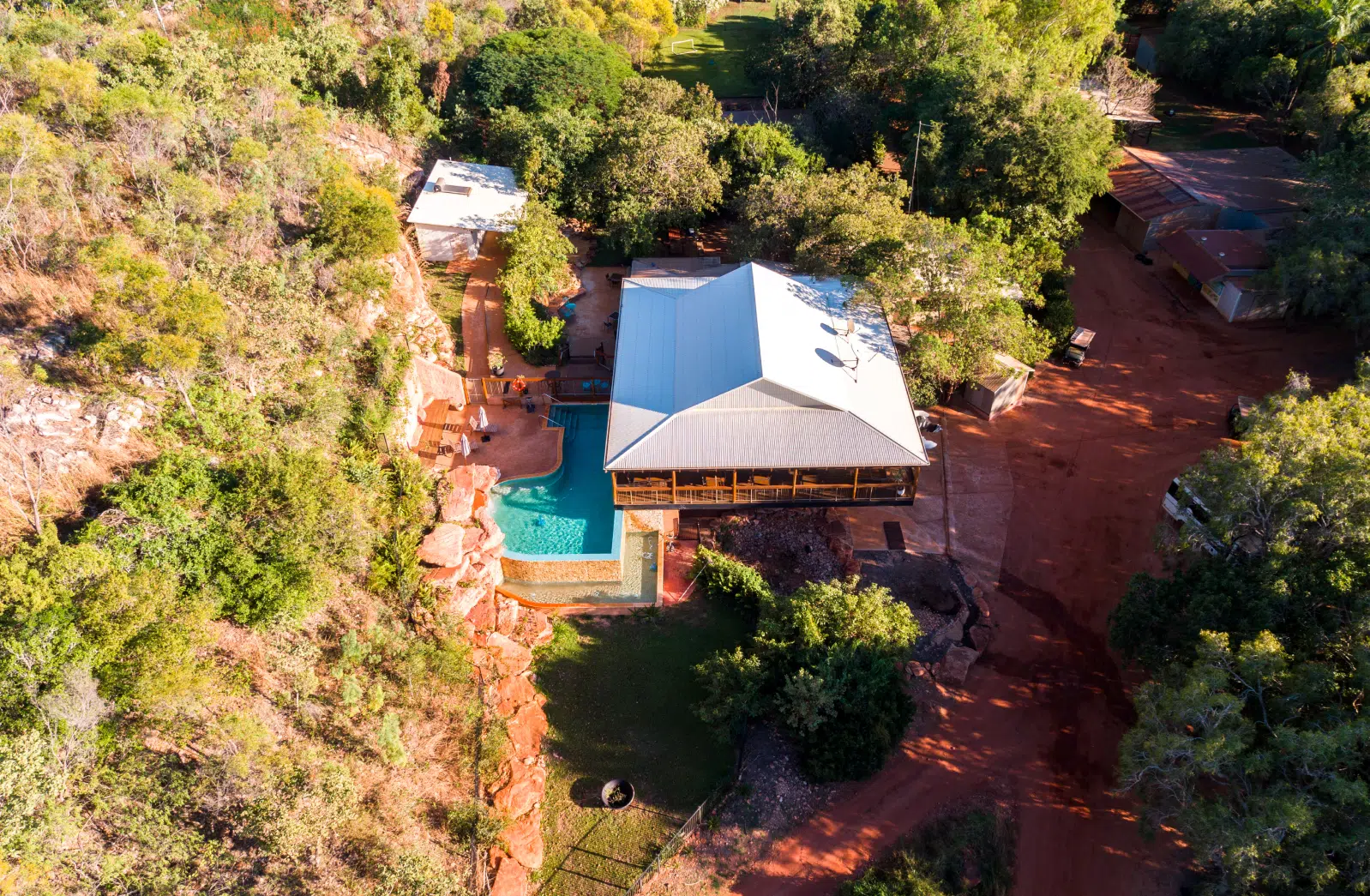 An aerial photo of the Pearler's Village, including the Homestead Restaurant, the infinity pool, Pearling shack and the beautiful Cygnet Bay waters.