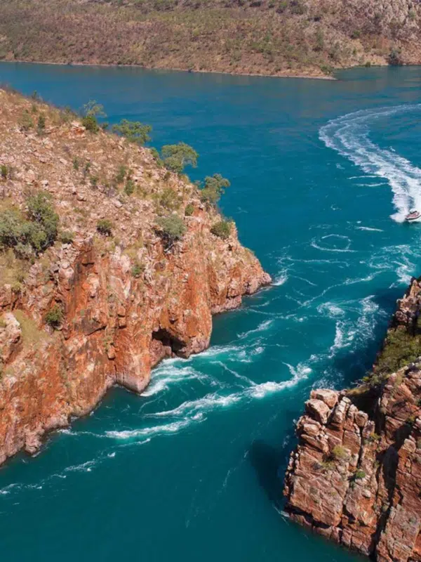 Aerial photo of the Horizontal Falls during a Ventur Atlas tour that takes guests over the falls in a light aircraft to witness the one in a lifetime experience that is the Horizontal Falls phenomenon. The waters of Talbot way are turquoise and still in contrast to the white caps of the rushing water surging through the gap between islands, creating Horizontal Falls.
